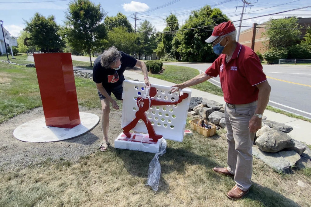 Mark Wholey and Paul Raymond unwrapping Follow Your Heart